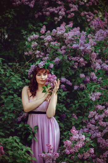 beautiful-girl-in-purple-dress-with-lilac-flowers-FPDYXV6.jpg